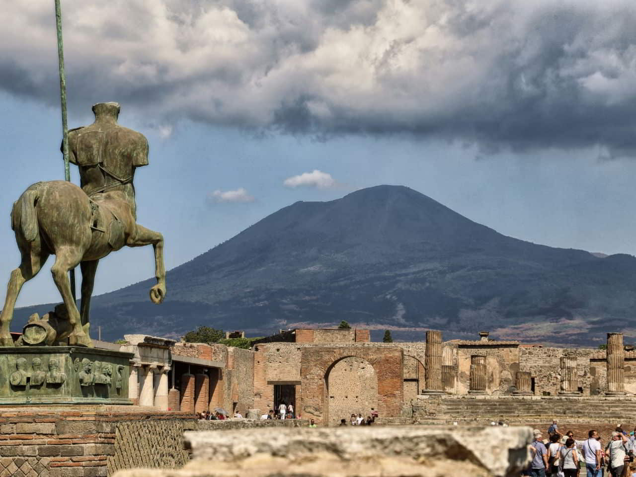 Igor Mitoraj sculpture on the side of Pompei with the Vesuvio view Pompeii