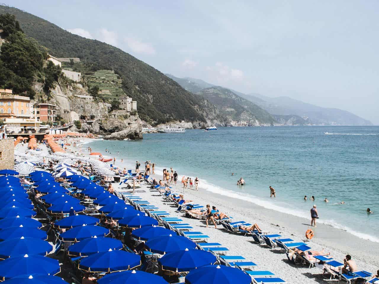 People relaxing on Fegina Beach doing one of the Best Things to do in Cinque Terre Italy