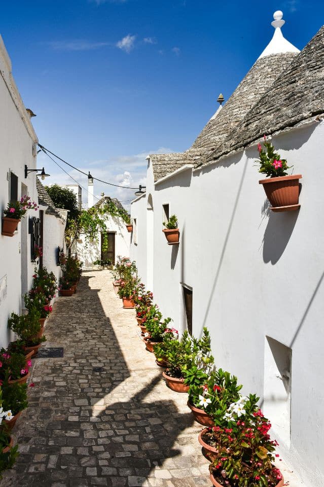 A cute little street of Alberobello Puglia's Trulli Town Italy