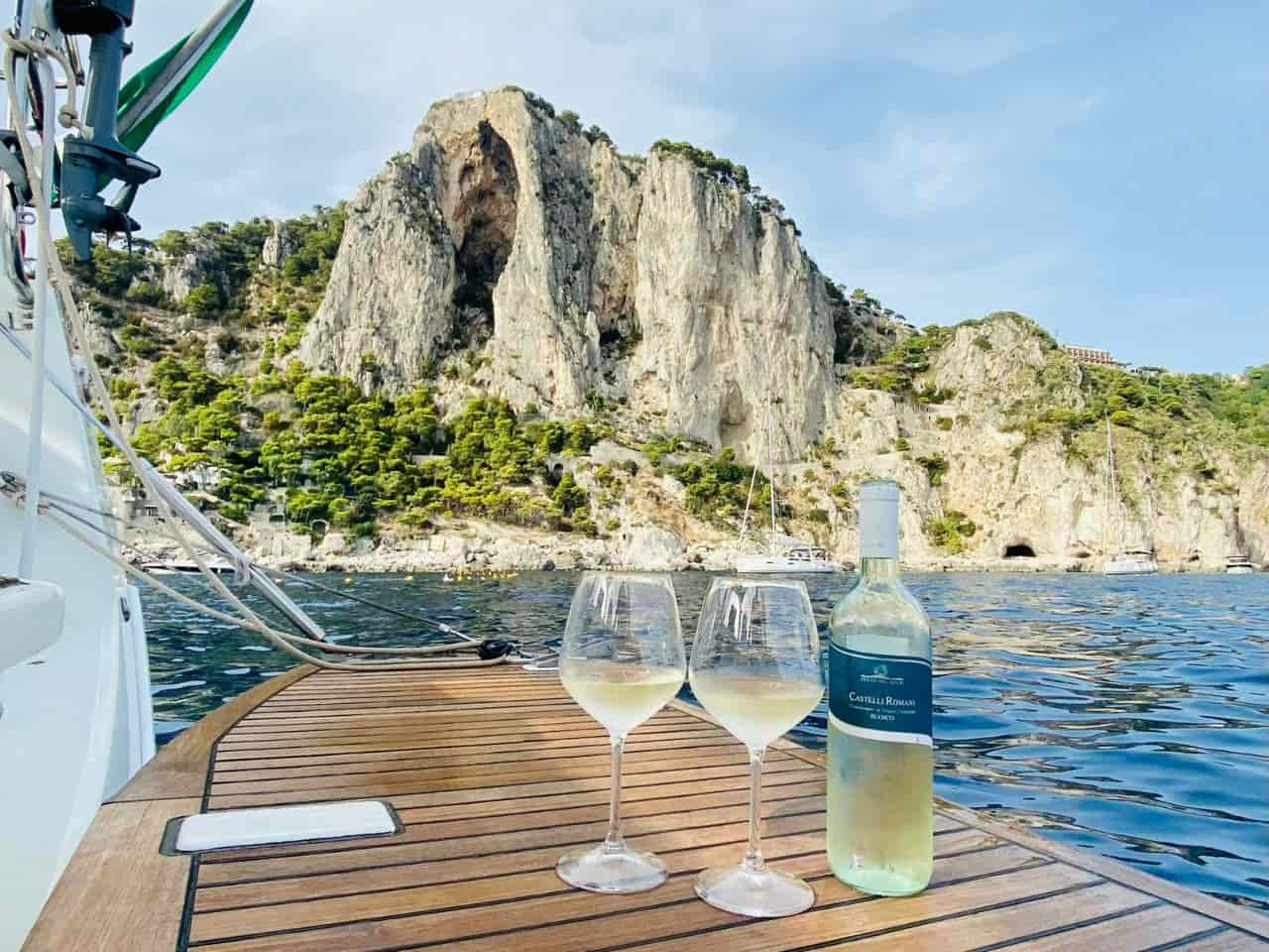 Caprese Wine Bottle with two glasses on a boat on Capri Island