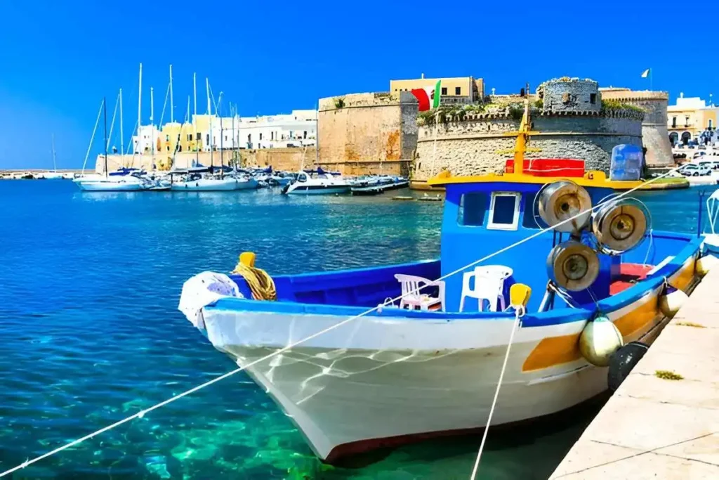 Old port of Gallipoli, view with castle and boats, Puglia , Italy