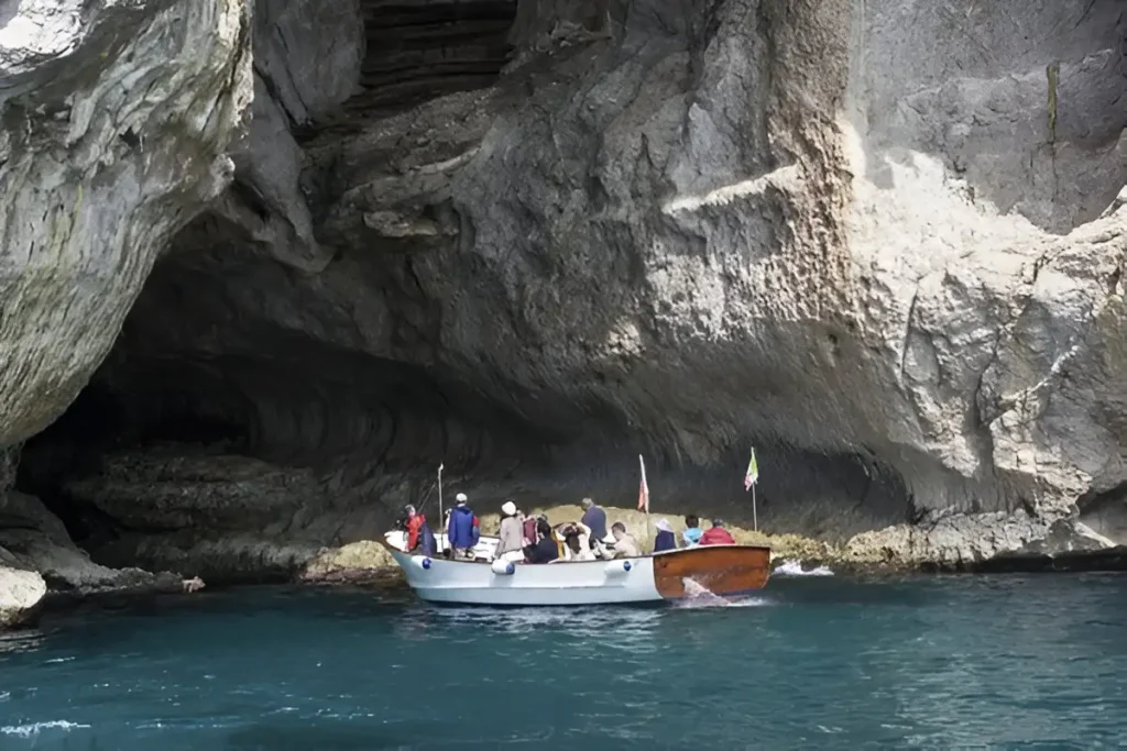 Boat entering into Blue Grotto in Capri 