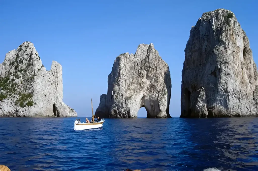 Visitors on Faraglioni Rocks Formations in Capri Island