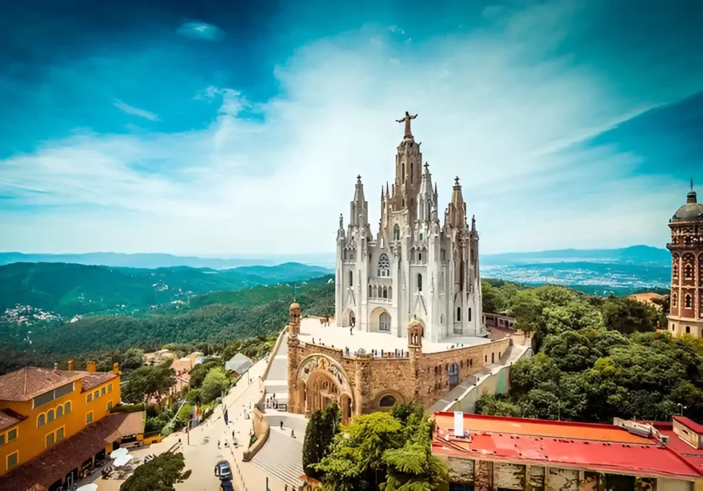 Tibidabo church on mountain in Barcelona with christ statue overviewing the city which is one of the most romantic places in the world