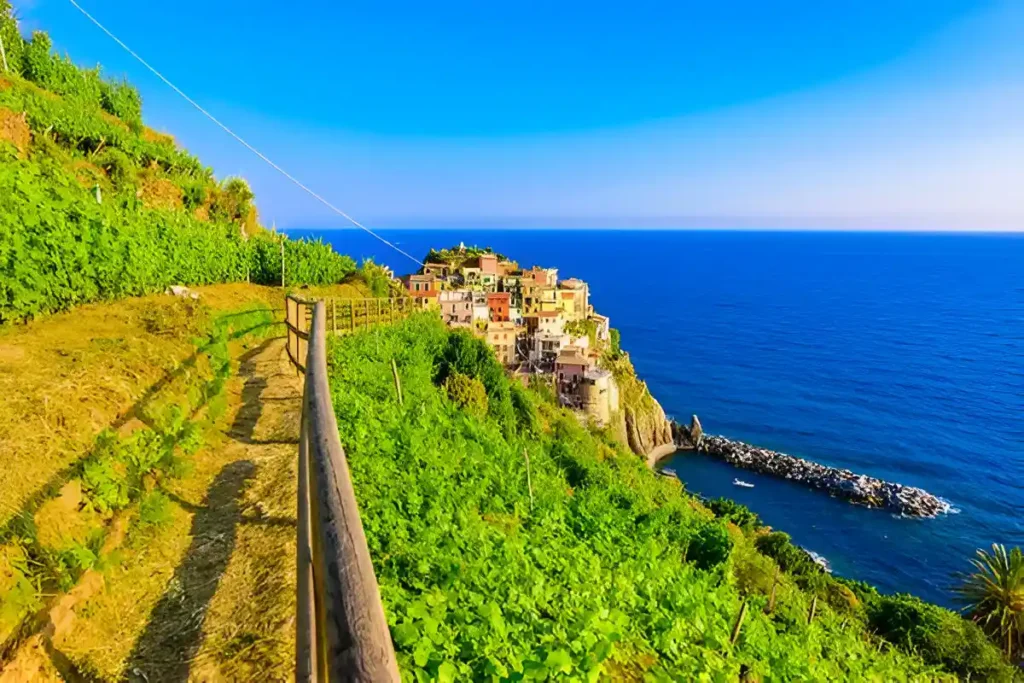 A stunning view of a village in Cinque Terre; Check out this guide to Cinque Terre