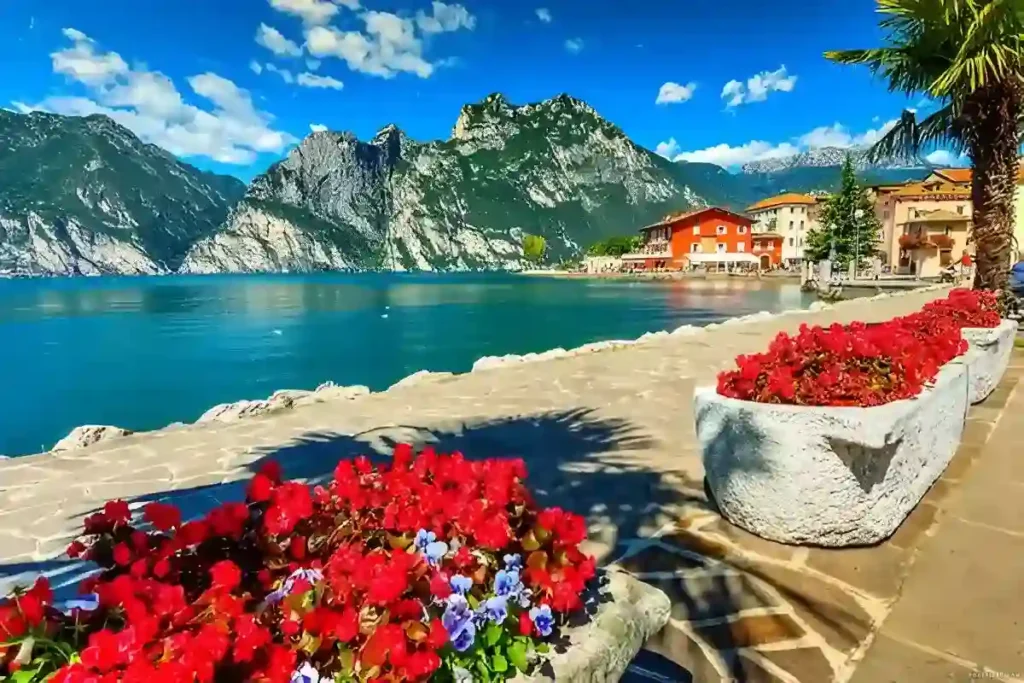 High mountains and walkway on the shore of Lake Garda; one of the Best Italian Lakes