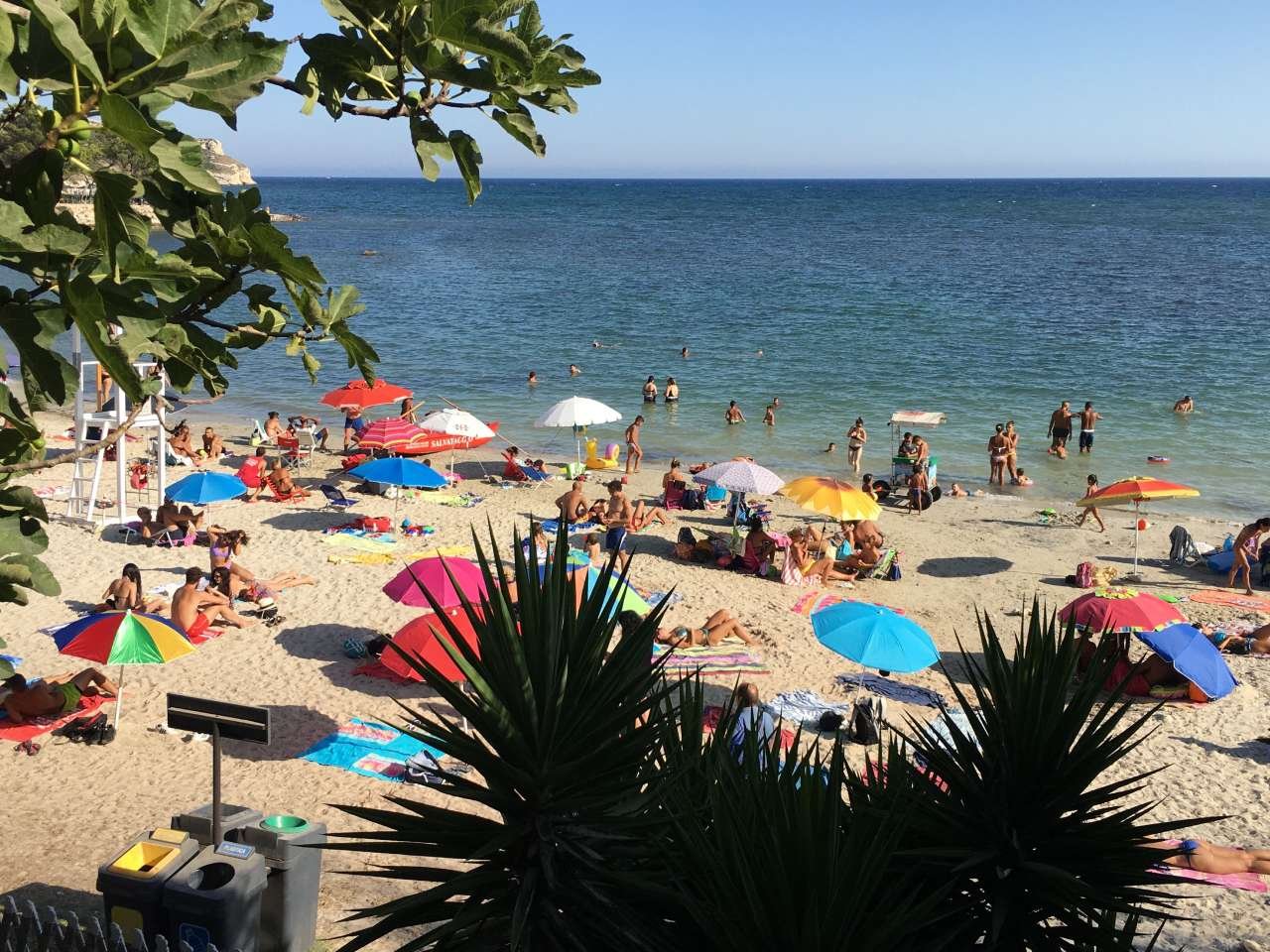 People relaxing on Poetta Beach in Cagliari, Sardinia Italy