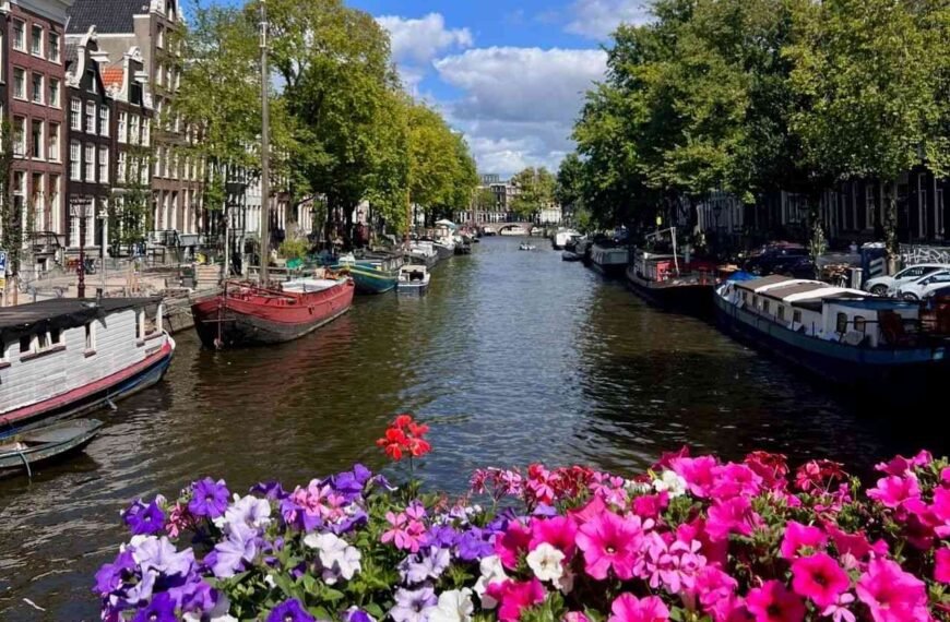 Spring canal-side street in Amsterdam, the best time to visit Europe